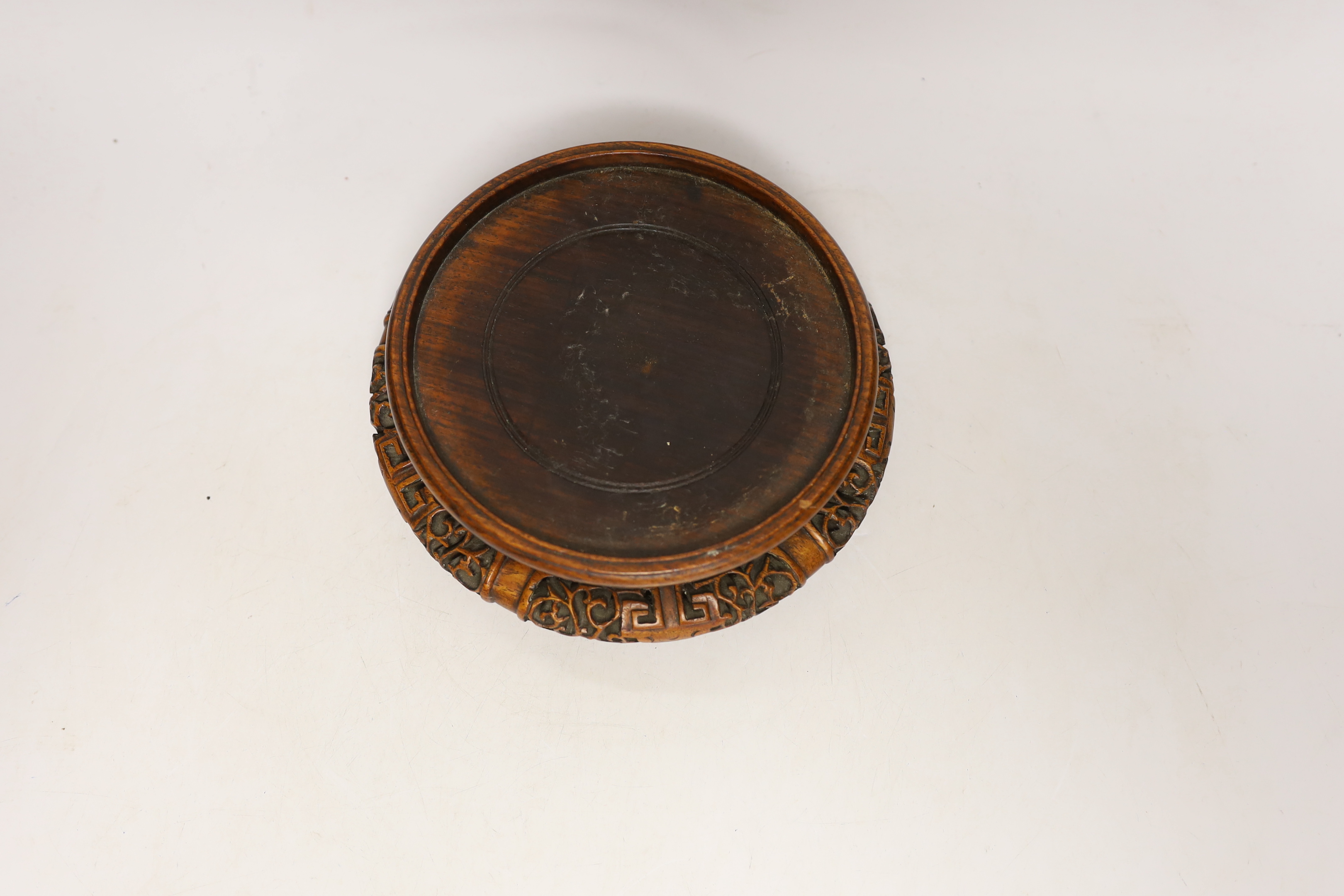 A Chinese hongmu stand, early 20th century, 19cm in diameter